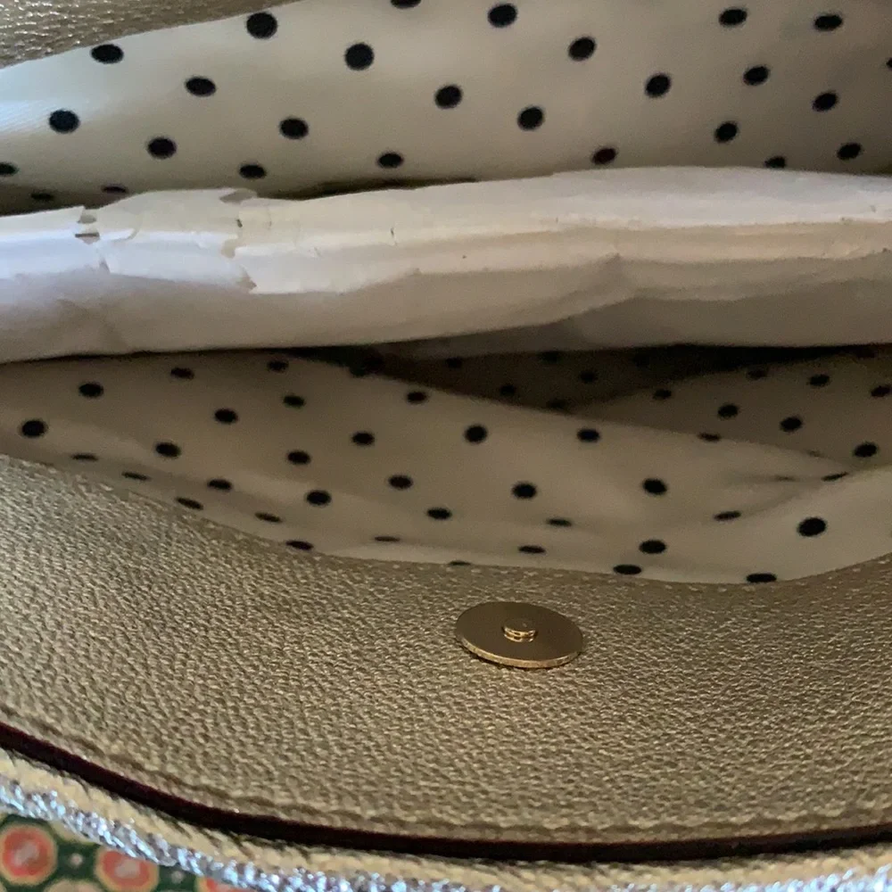 Kate spade gold‎ metallic bow purse. Never used. Retail 298